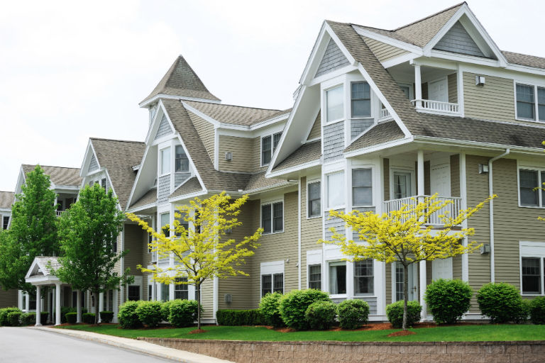 row of condos or apts | 3 Considerations When Hiring a Commercial Landscape Company | Hittle Landscaping